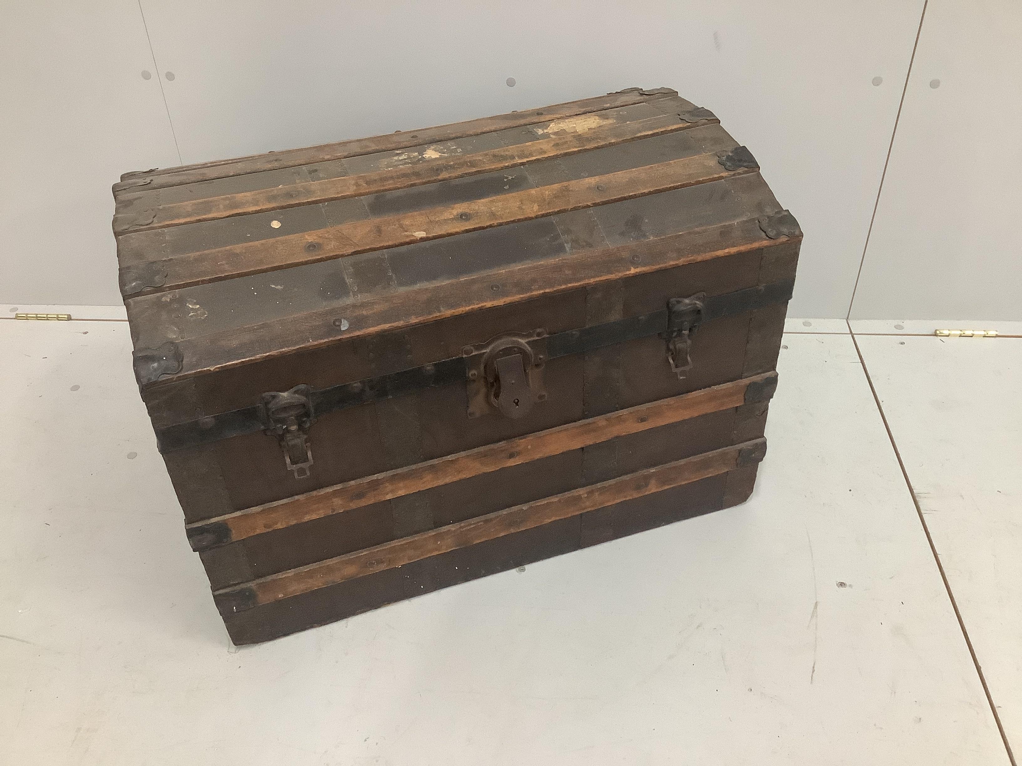 An Edwardian domed top trunk, width 77cm